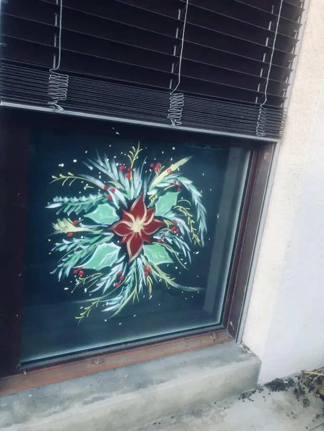 Poinsettia bouquet painted on a window
