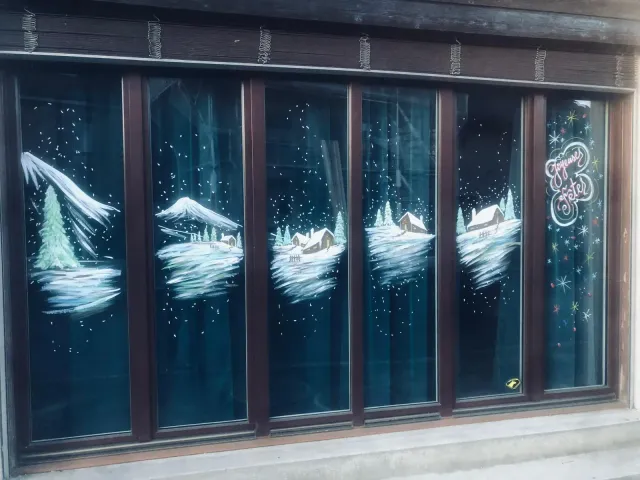 Glass doors painted with snowy landscapes