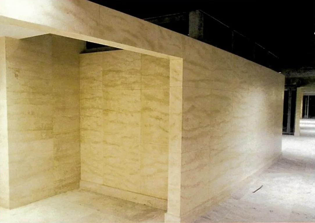 Faux travertine on a large wall volume